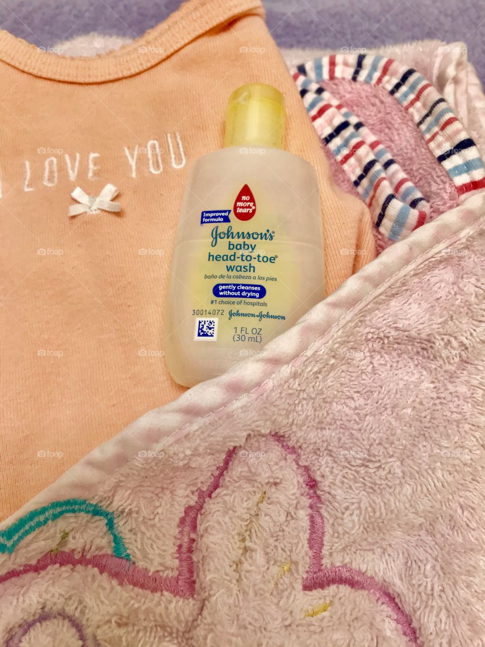 Getting baby’s bath supplies ready with travel size Johnson’s Head to Toe wash. 