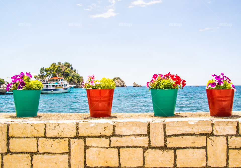 Colorful Flower Pots At Seascape In Parga Greece