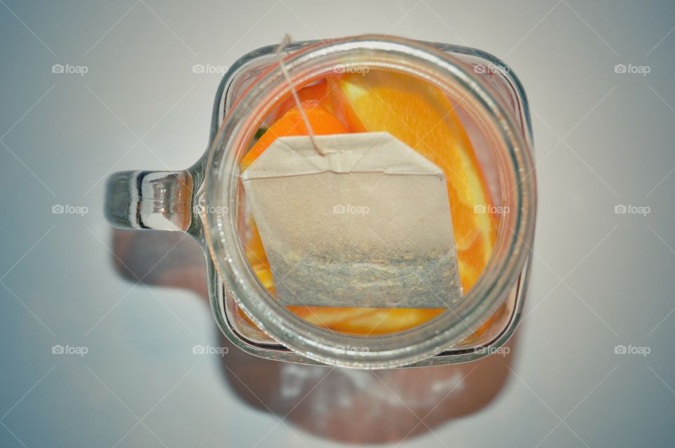 Preparing rooibos tea with slices of orange