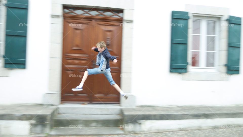 Just passing by. Jumping boy