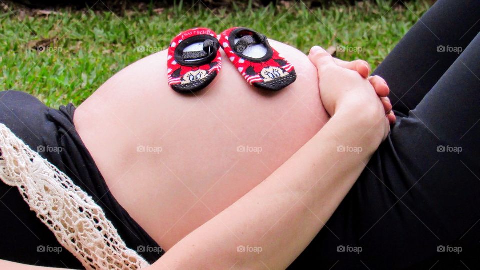 Love moment-Pregnant woman lying on the grass