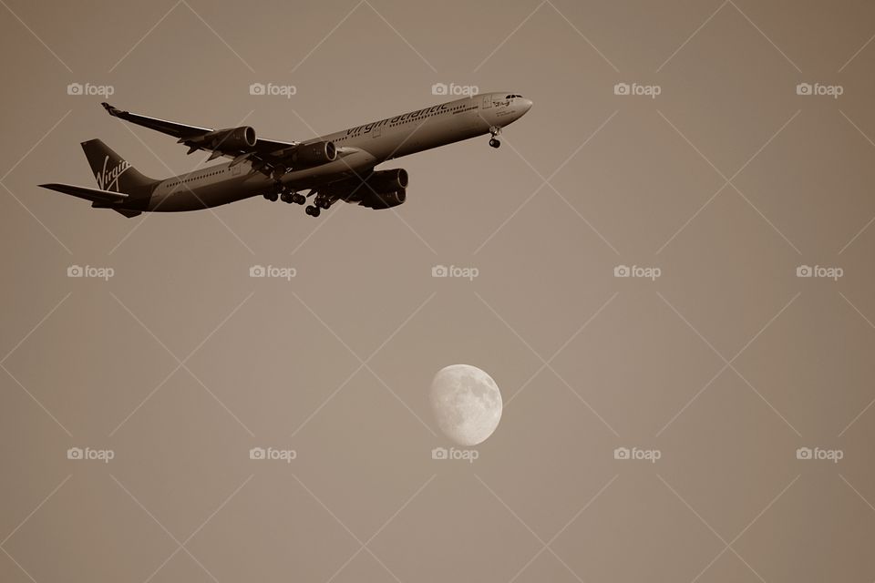 Plane under the moon