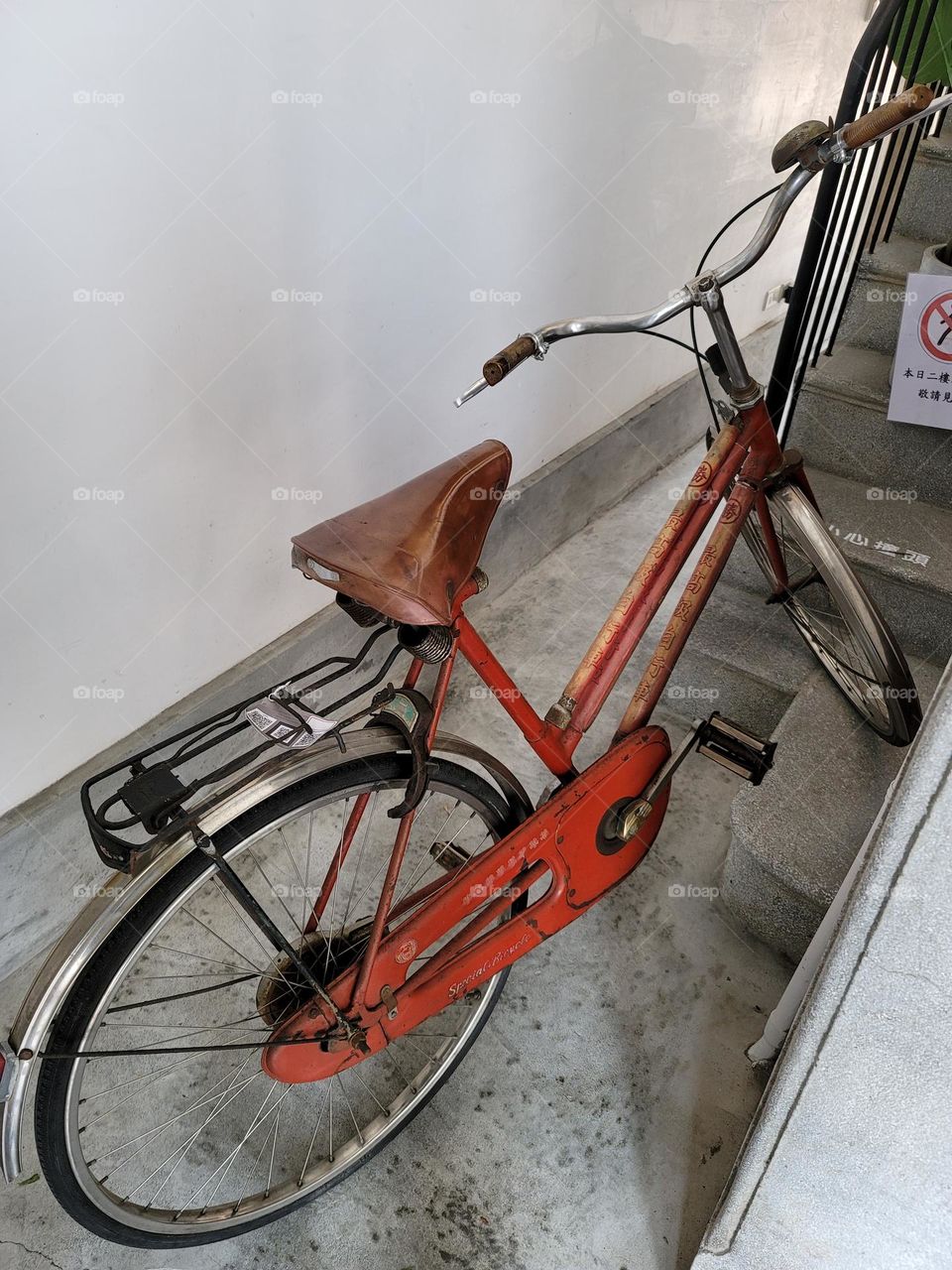 A bicycle parked in a small space in a monument