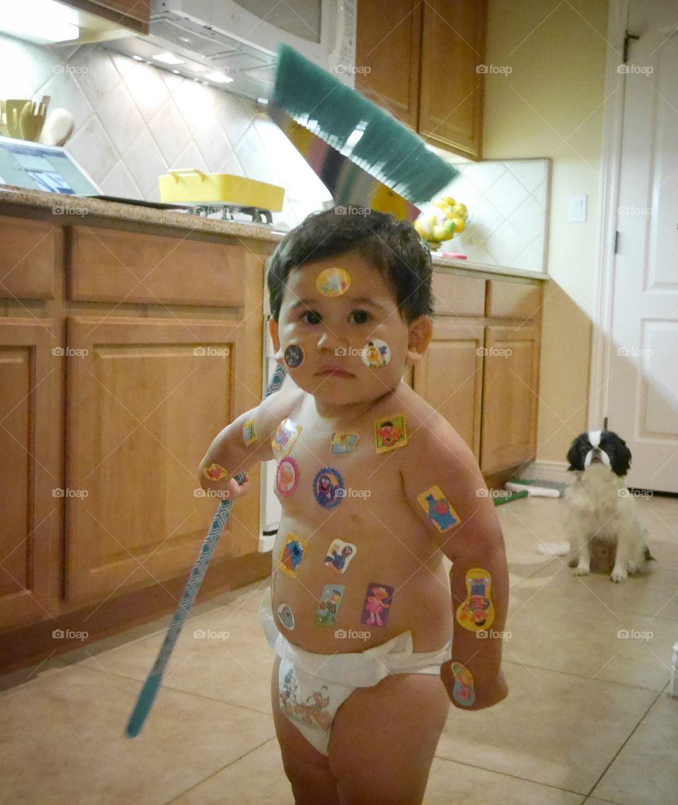 A boy with stickers on his face