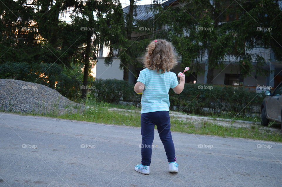 Girl trying to makes bubbles