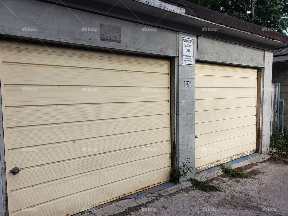 double garage doors on an old concrete garage