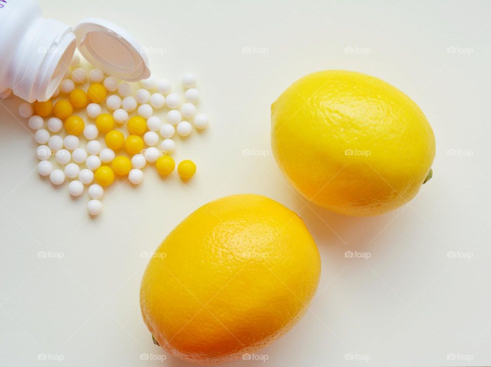 vitamins round and lemon 🍋 top view on a white background healthy