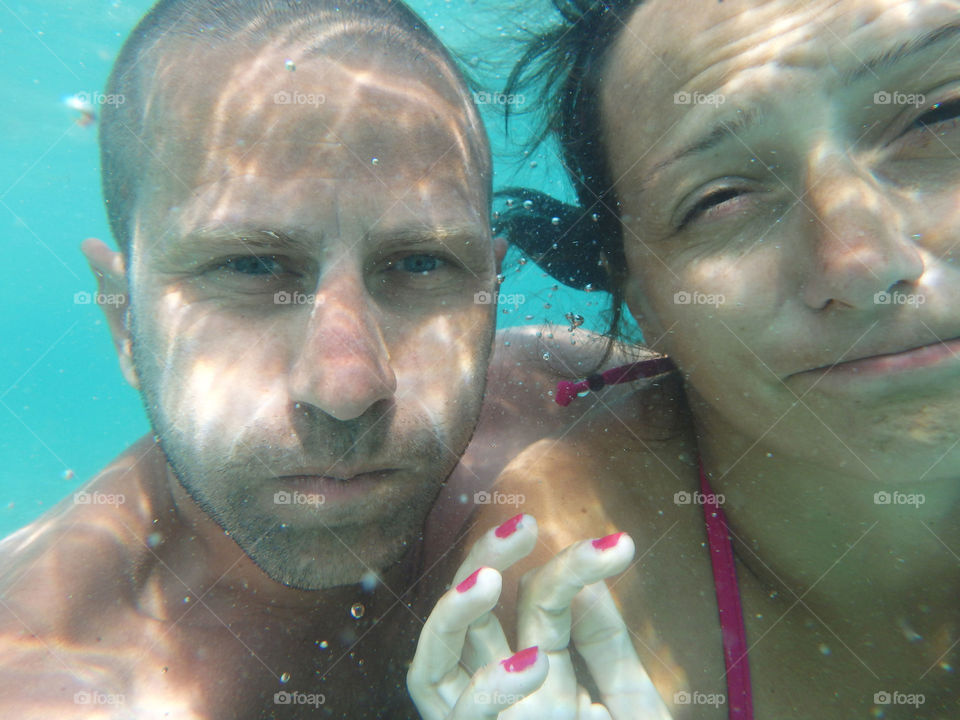 couple under the sea. couple portrait underwater