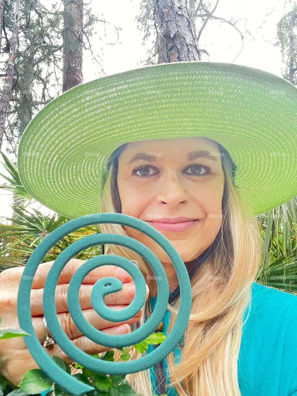 Woman displaying a mosquito coil.