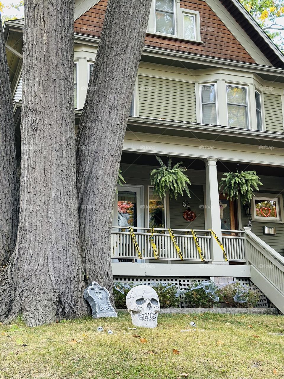 Halloween decorations and celebration in Toronto, Ontario. Ghosts, witches and skeletons. Creative art. Autumn, fall city landscape.