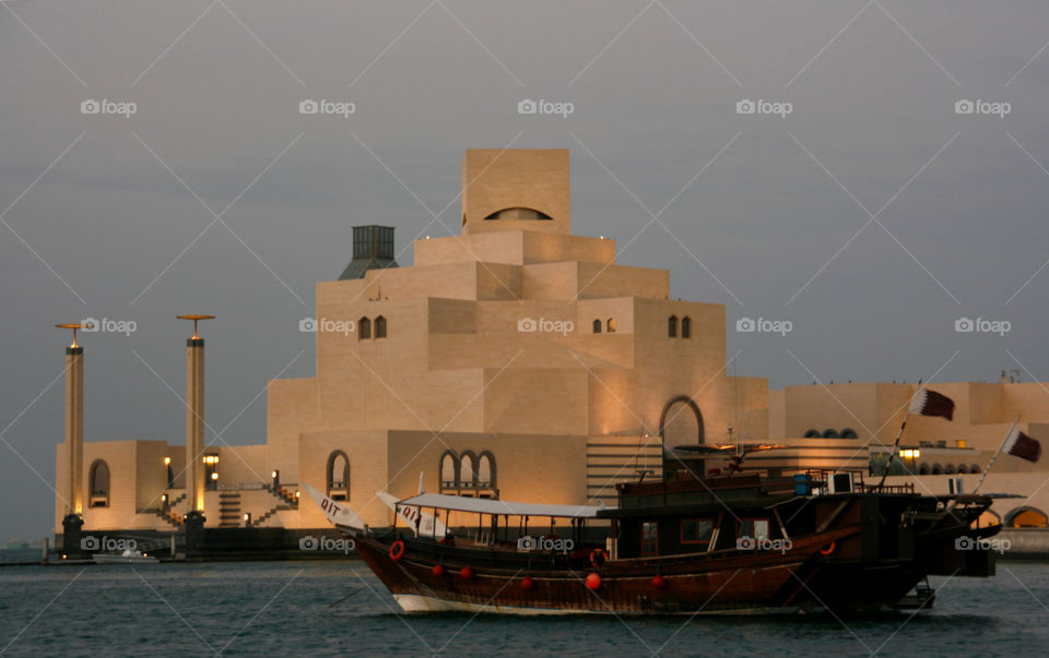 A traditional boat in front of the Museum of Islamic Art in Doha, Qatar