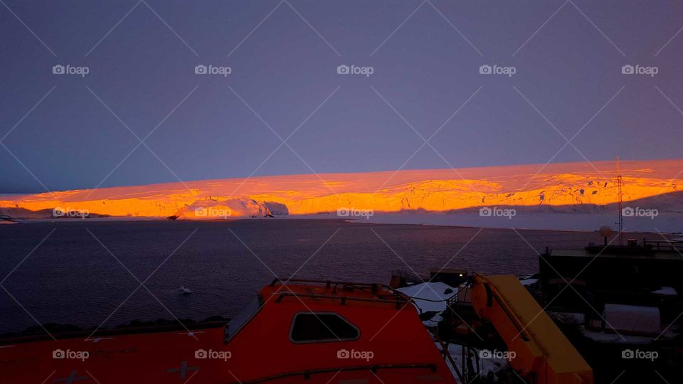 Vivid austral sunset on a glacier: Arthur Harbor, Anvers Island, Antarctica