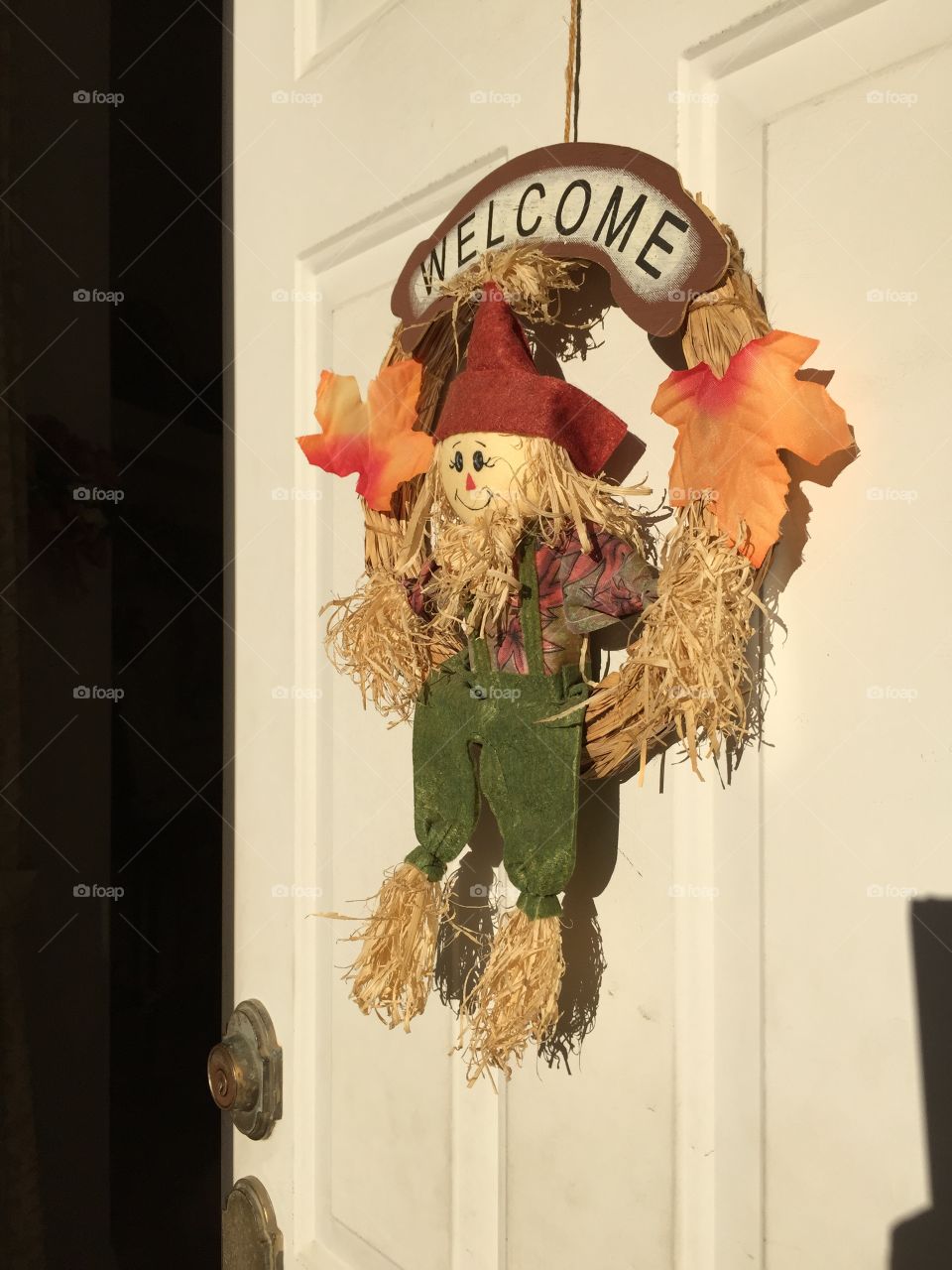 Autumn Scarecrow On Door. Seasonal Fall Scarecrow Decoration With Welcome Sign Hanging On The Front Door 