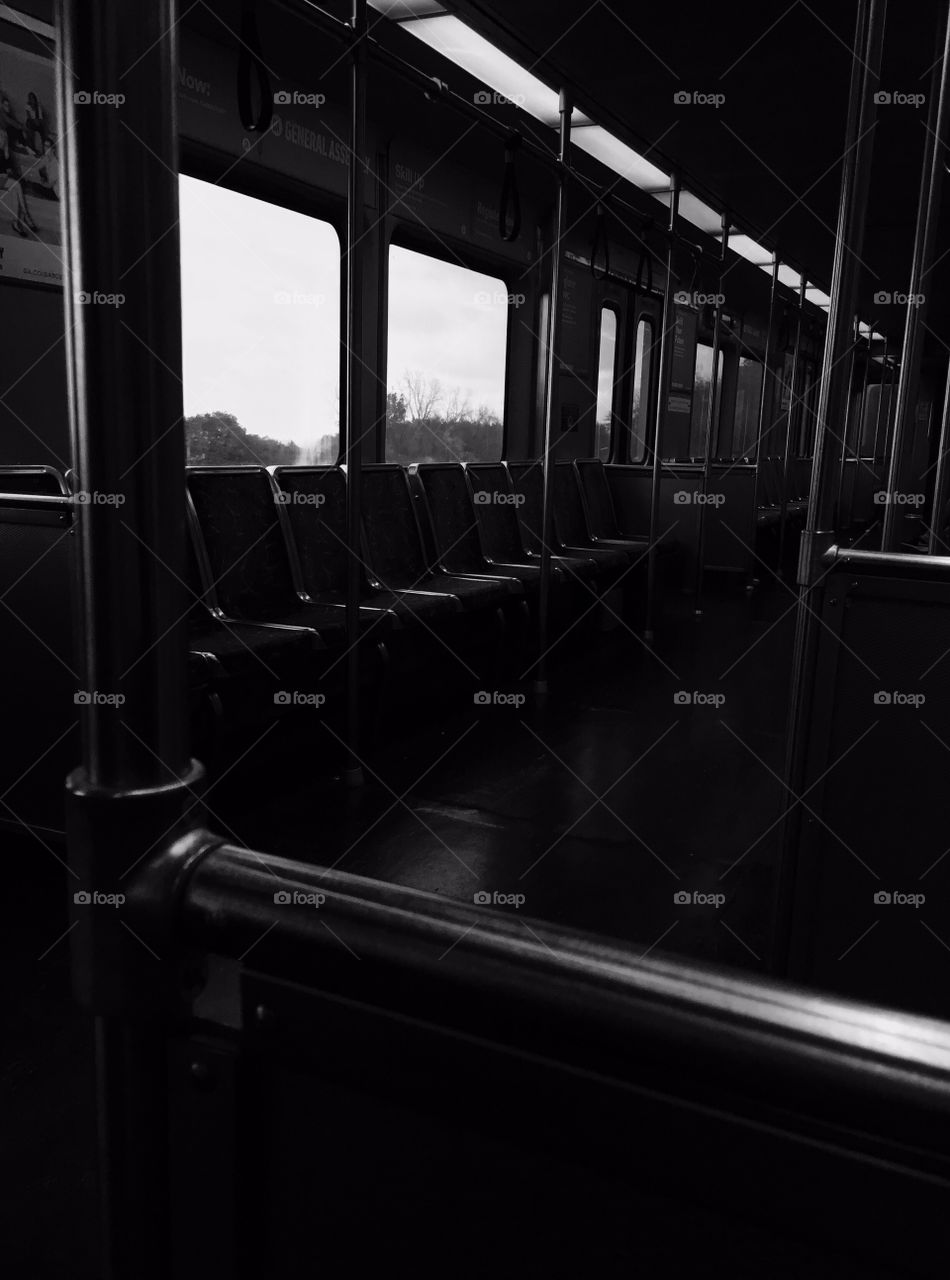 Black and white picture of an empty train cart
