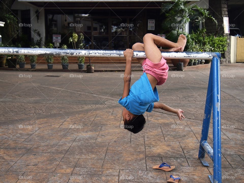 young boy playing at a playground