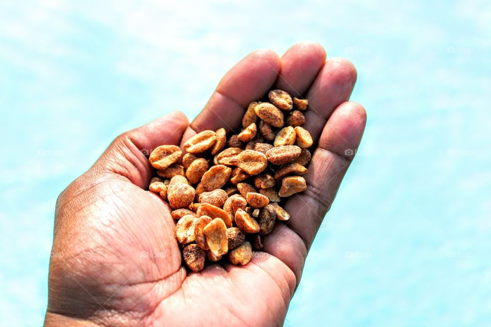 holding honey roasted peanuts