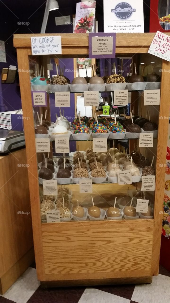 Various candy caramel apples at a sweets shop