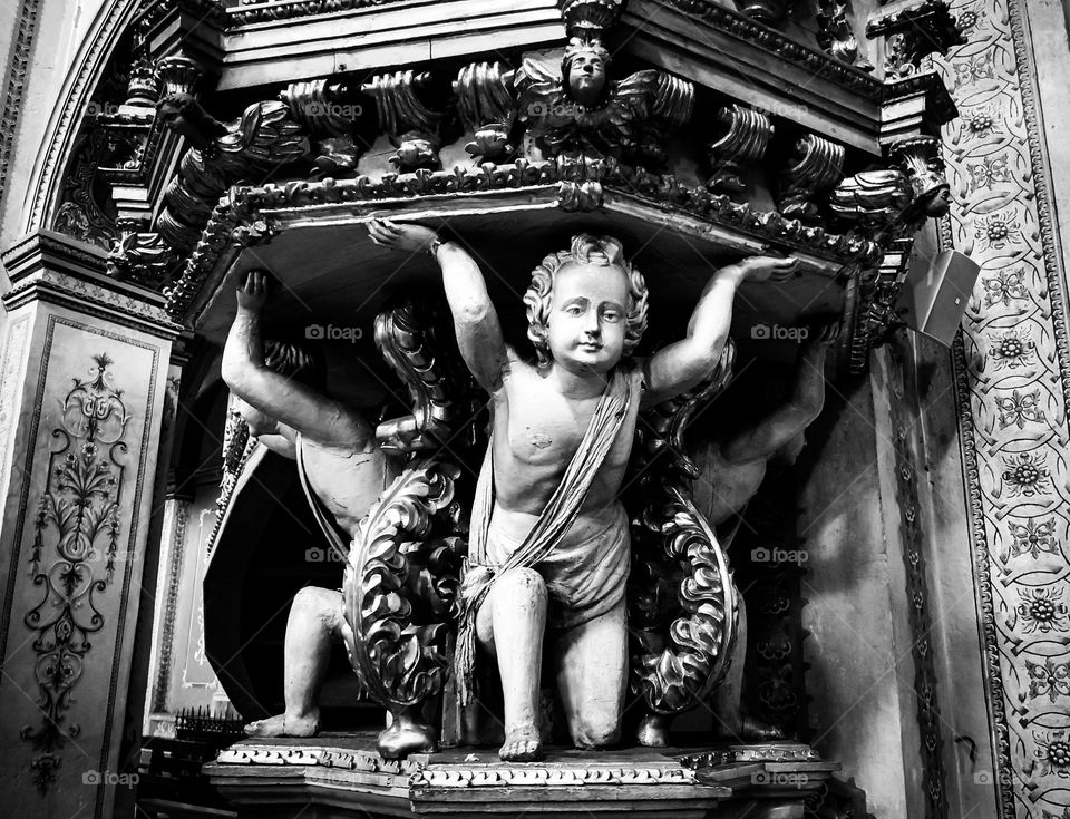 Angels in the pulpit... Very common in several ancient churches in Quito