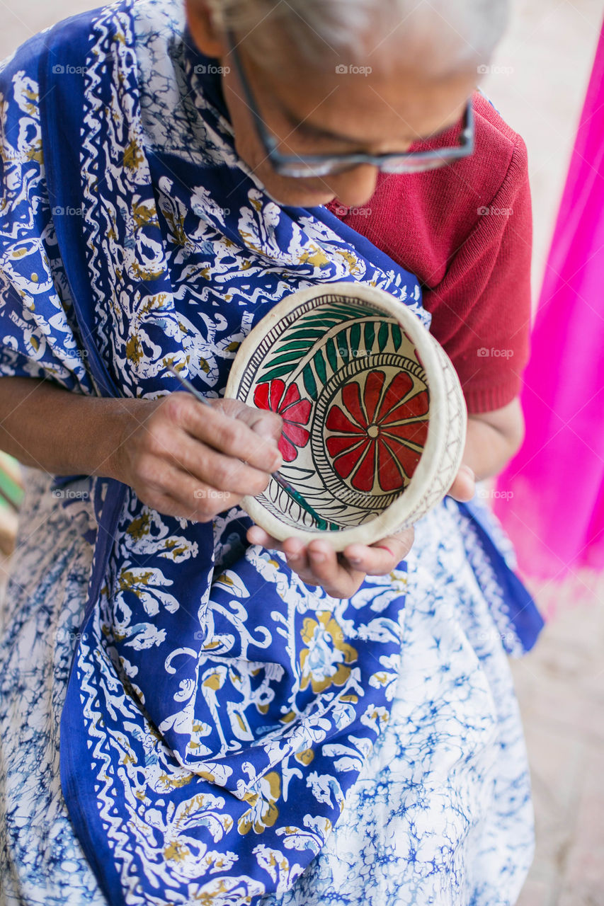 Elderly woman in her craft