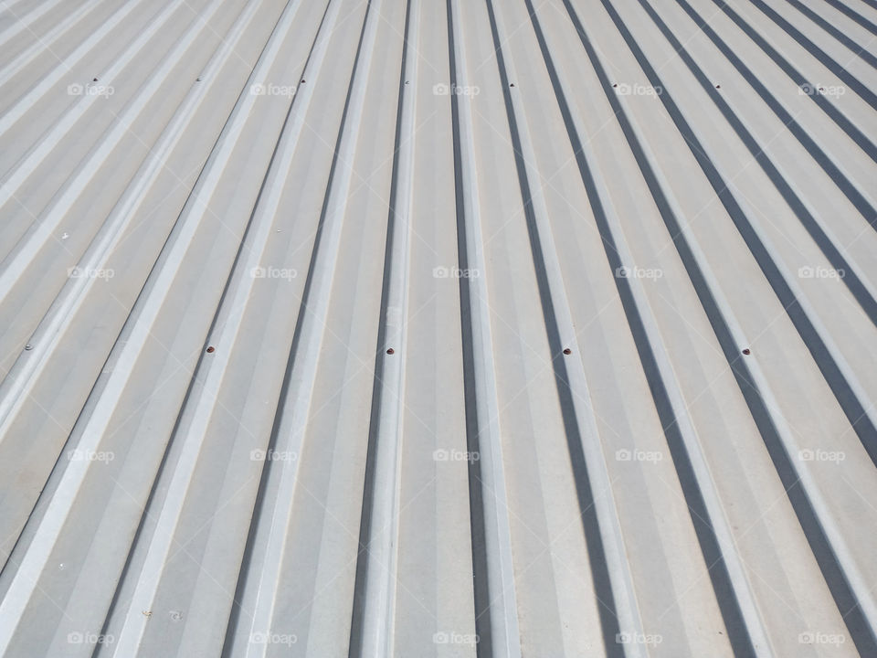 Photograph of grey metal sheet part of a roof.