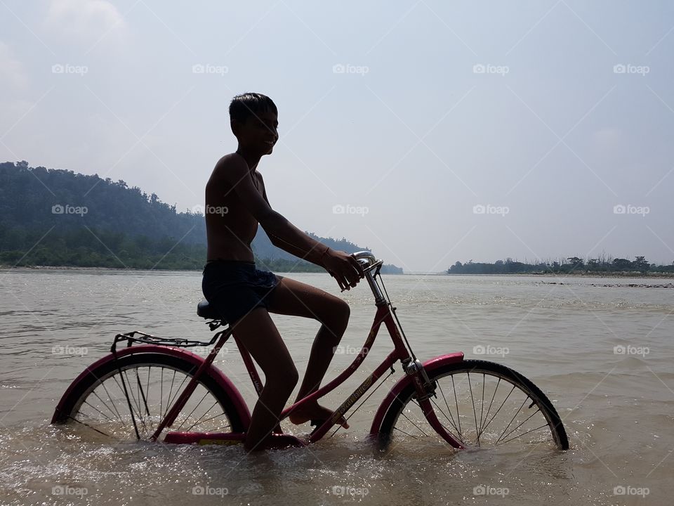 bicycling in ganga river at rishikesh