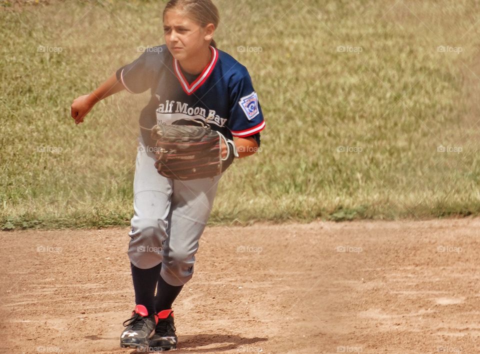 Girl Power. Young Woman Playing Baseball
