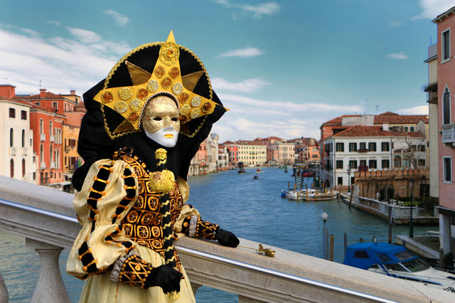 Person in costume standing near canal