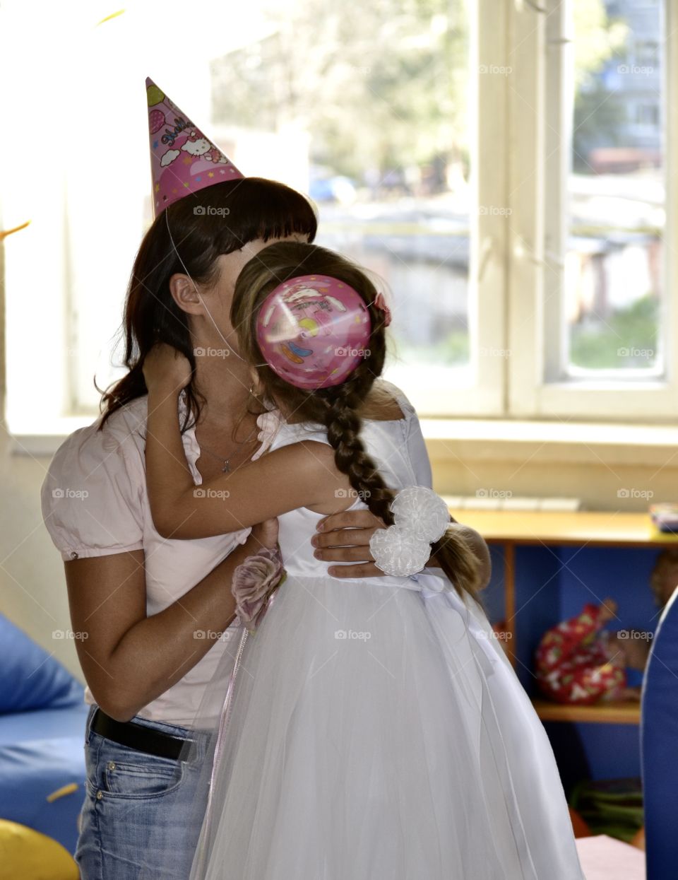 Happy Birthday! Mom wishes her daughter a happy birthday, hugs and kisses her.