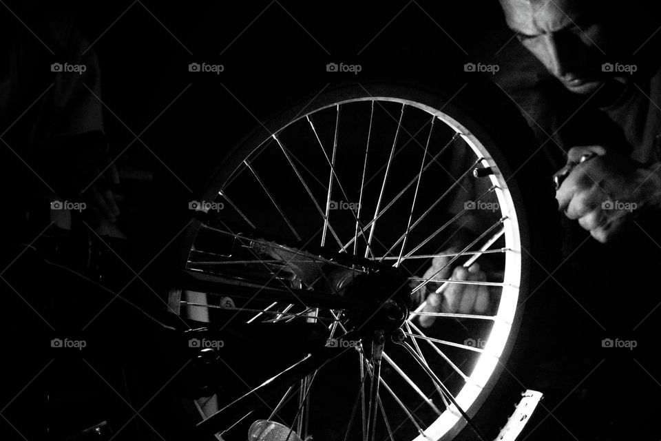 father and daughter repairing Bicycle