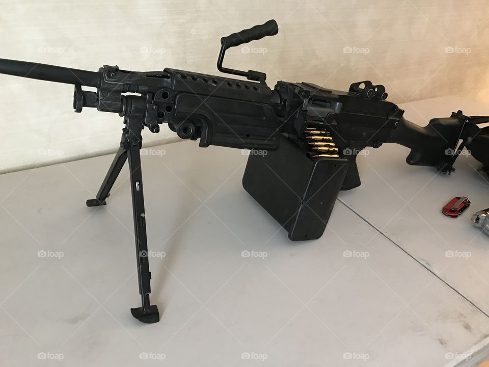M249 belt fed 50 cal machine gun with bi-pod stabilizer locked and loaded. 