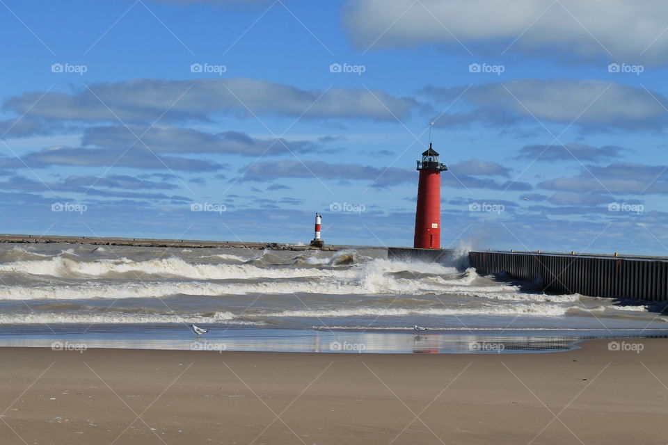 waves and lighthouse on Lake Michigan