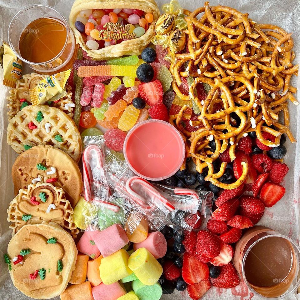 Festive party box full of yummy goodies of gummies and waffles 