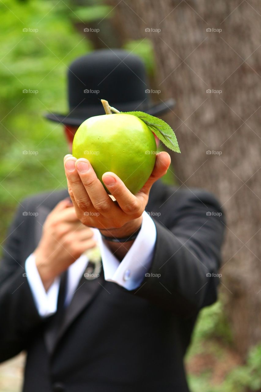 Man and green apple