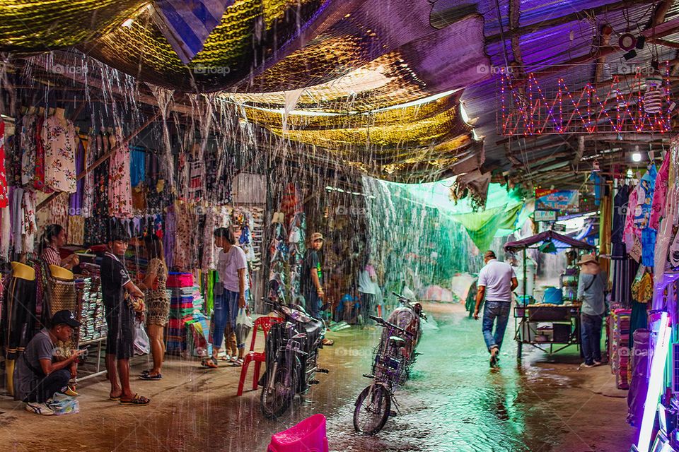 a rainshower at the Thai Street Chong Chom Market in Surin somewhere in Isan Thailand Southeast Asia