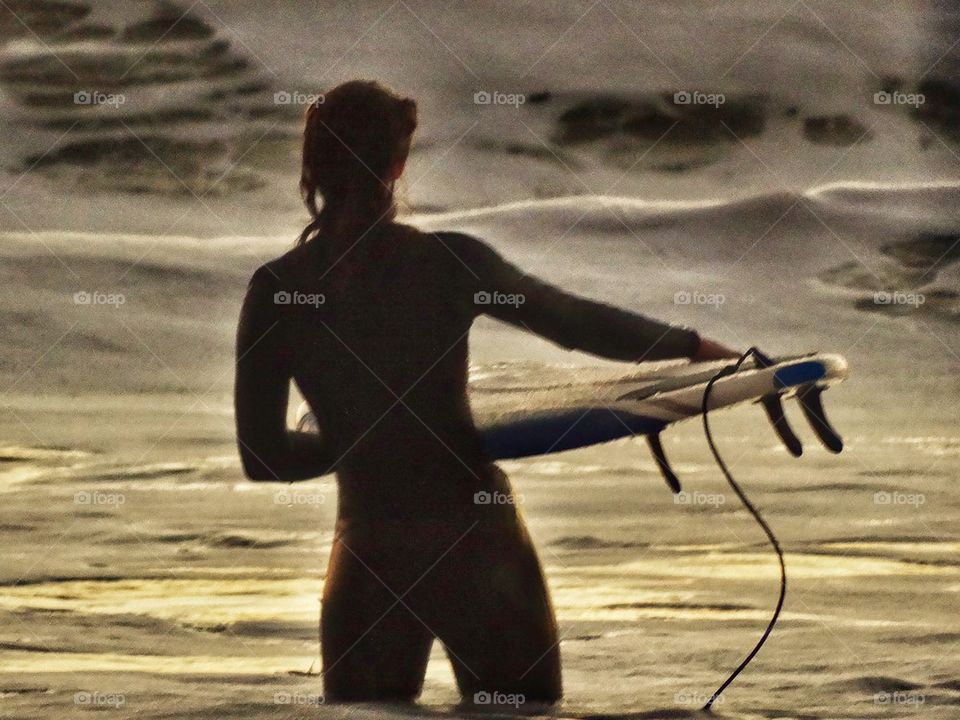 Toned And Muscular Surfer Girl Waiting To Catch A Wave. Surfer Girl
