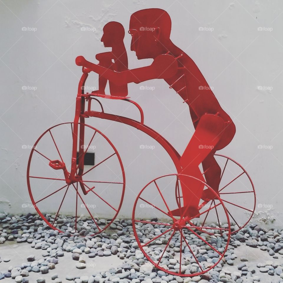 Red Tricycle Sculpture