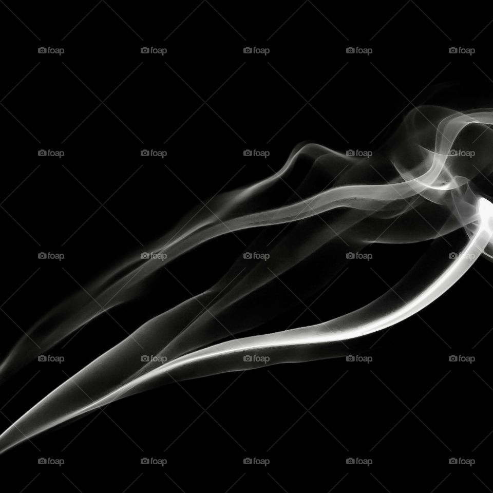 White smoke against a black background 