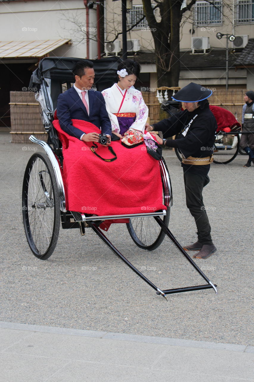 Traditional couple in rickshaw at Tokyo Japan