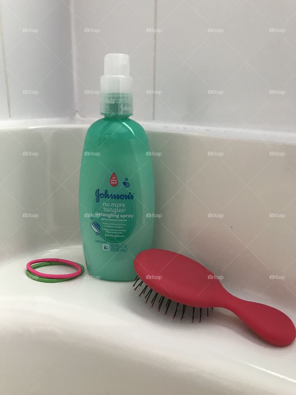 Johnson and Johnson no more tears hair product with a pink hairbrush. 