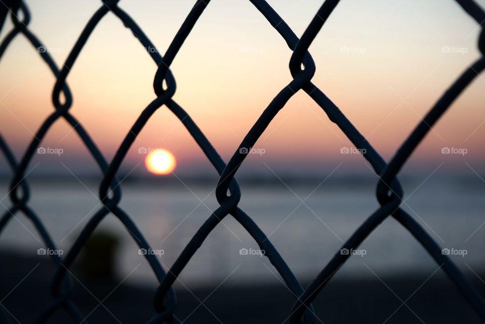 Beautiful sunset behind bars