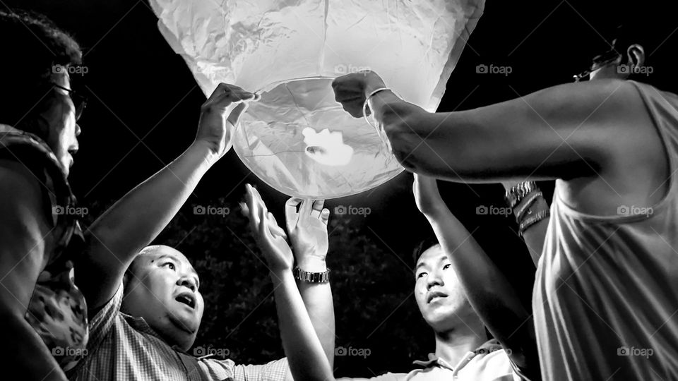 a man who gasped as the flames on the sky lanterns started and waited to take off