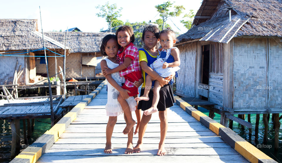 Four little girls in a bajo village in Sulawesi, Indonesia 