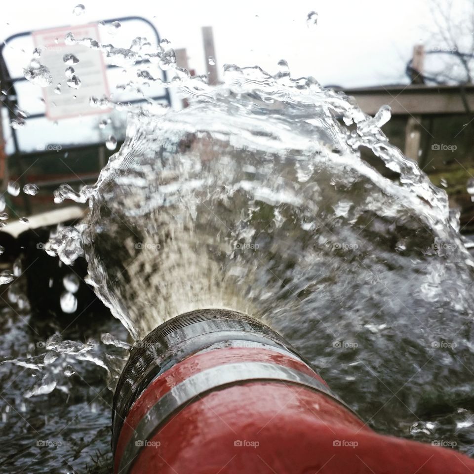 water bursts from a pump