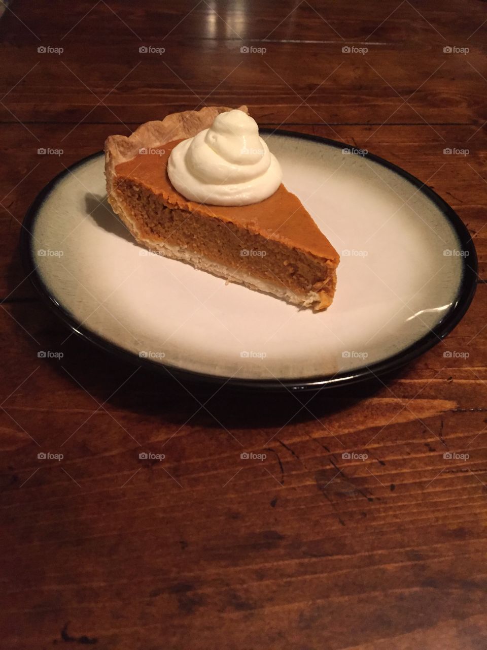 Perfect slice of homemade pumpkin pie with homemade whipped cream!!