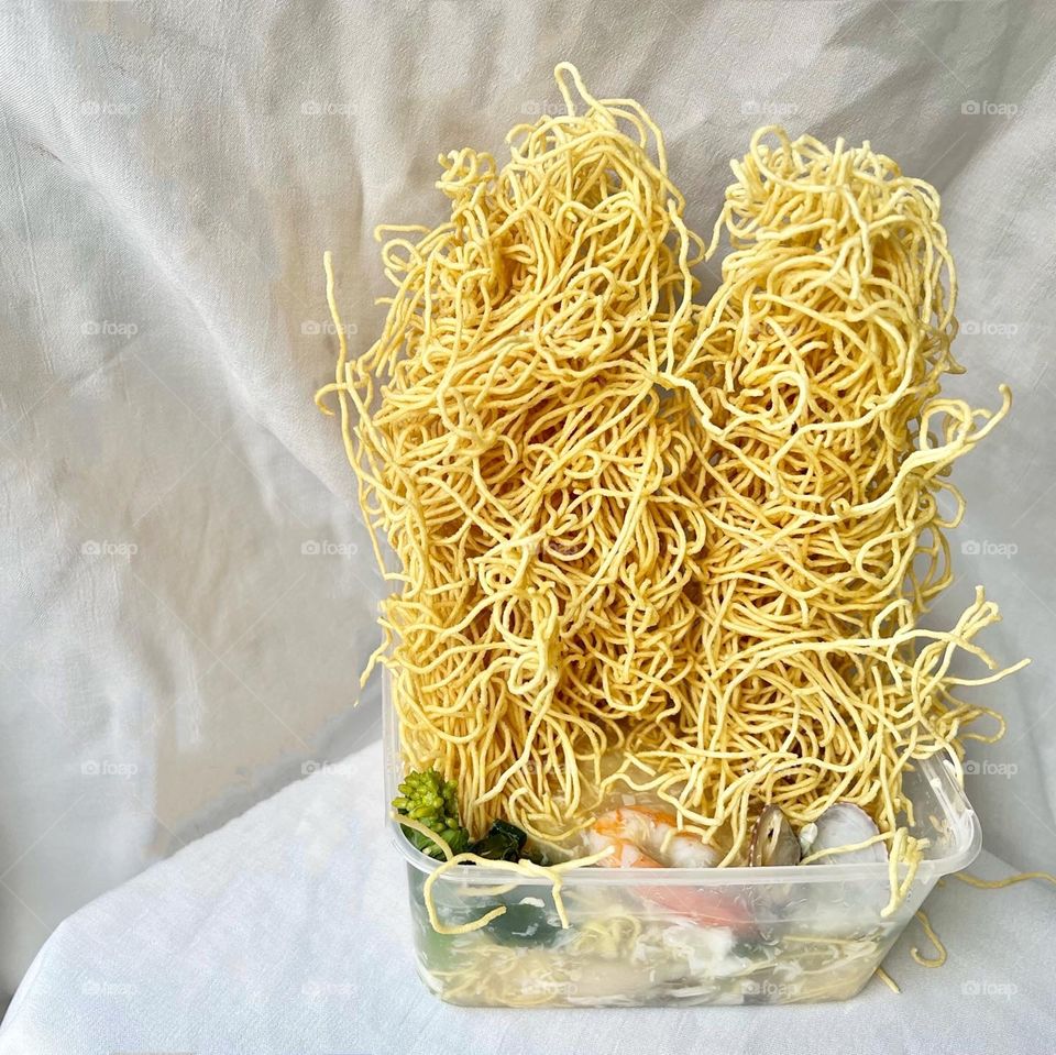 Asian food includes lala clam soup, curry fish head, bitter gourd pork and crispy twin tower noodles 