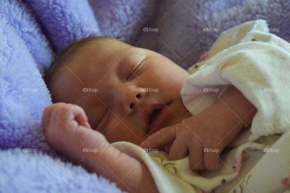 So sweet one week old baby girl dreaming sweet dreams 