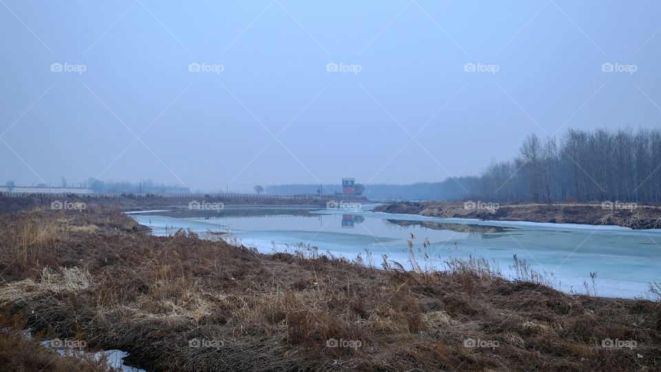 the ice on the river is melting