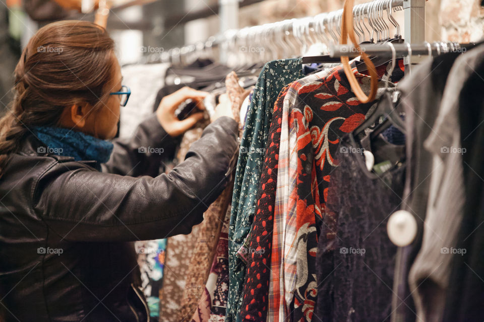 Woman is shopping at the boutique 