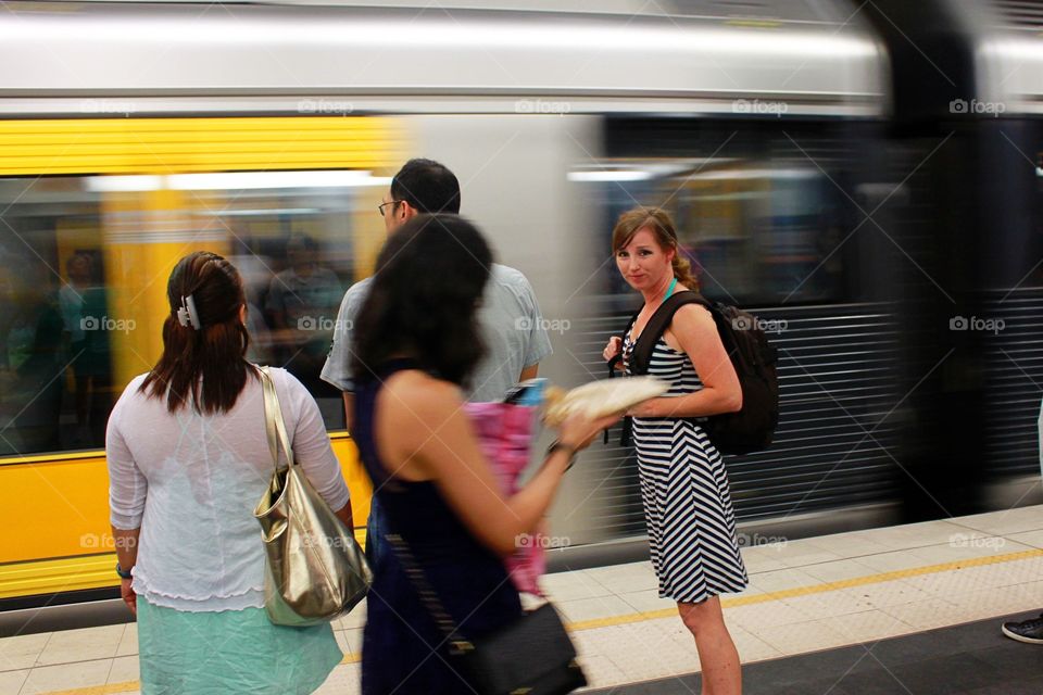 Passengers at station waiting for train