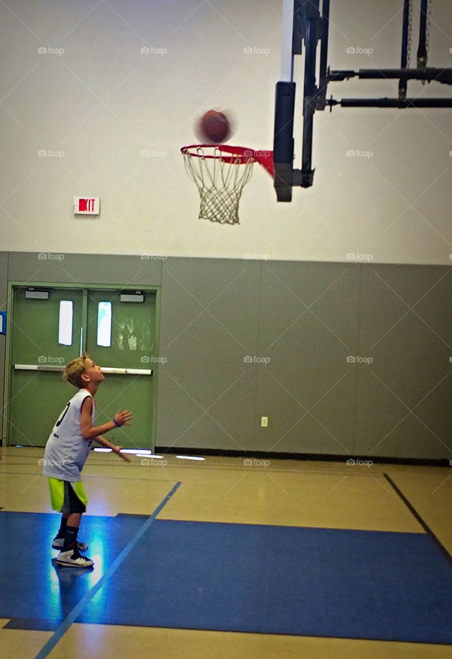 Boy playing basketball